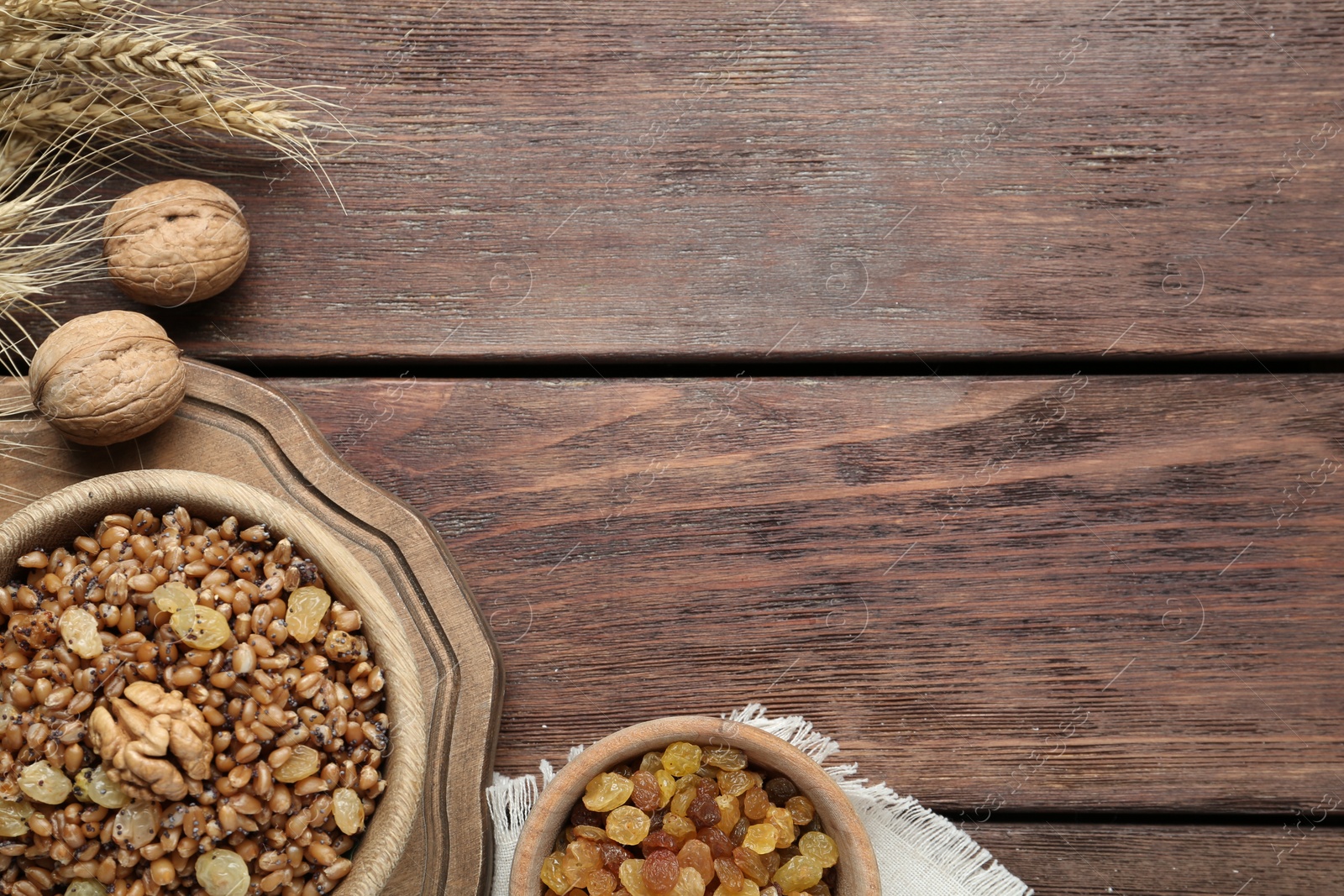 Photo of Traditional Christmas slavic dish kutia served on wooden table, flat lay. Space for text