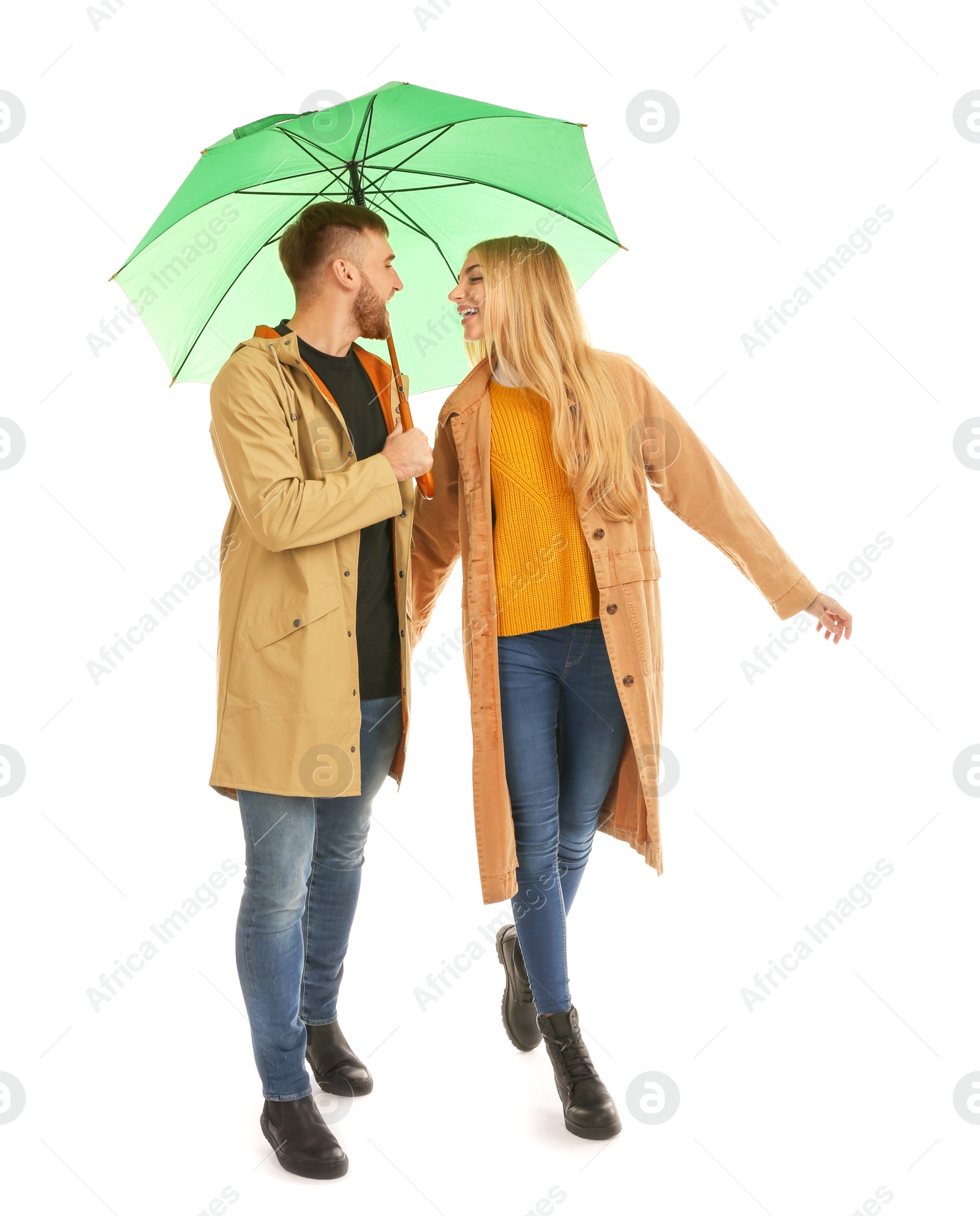 Photo of Full length portrait of beautiful couple with umbrella, isolated on white