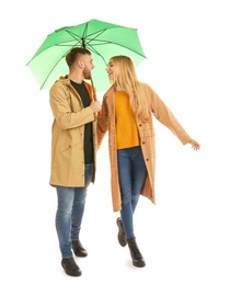 Photo of Full length portrait of beautiful couple with umbrella, isolated on white