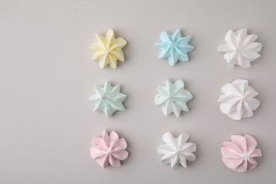 Photo of Delicious meringue cookies on light background, flat lay. Space for text