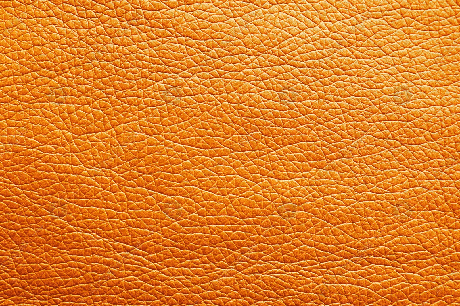 Image of Texture of orange leather as background, closeup