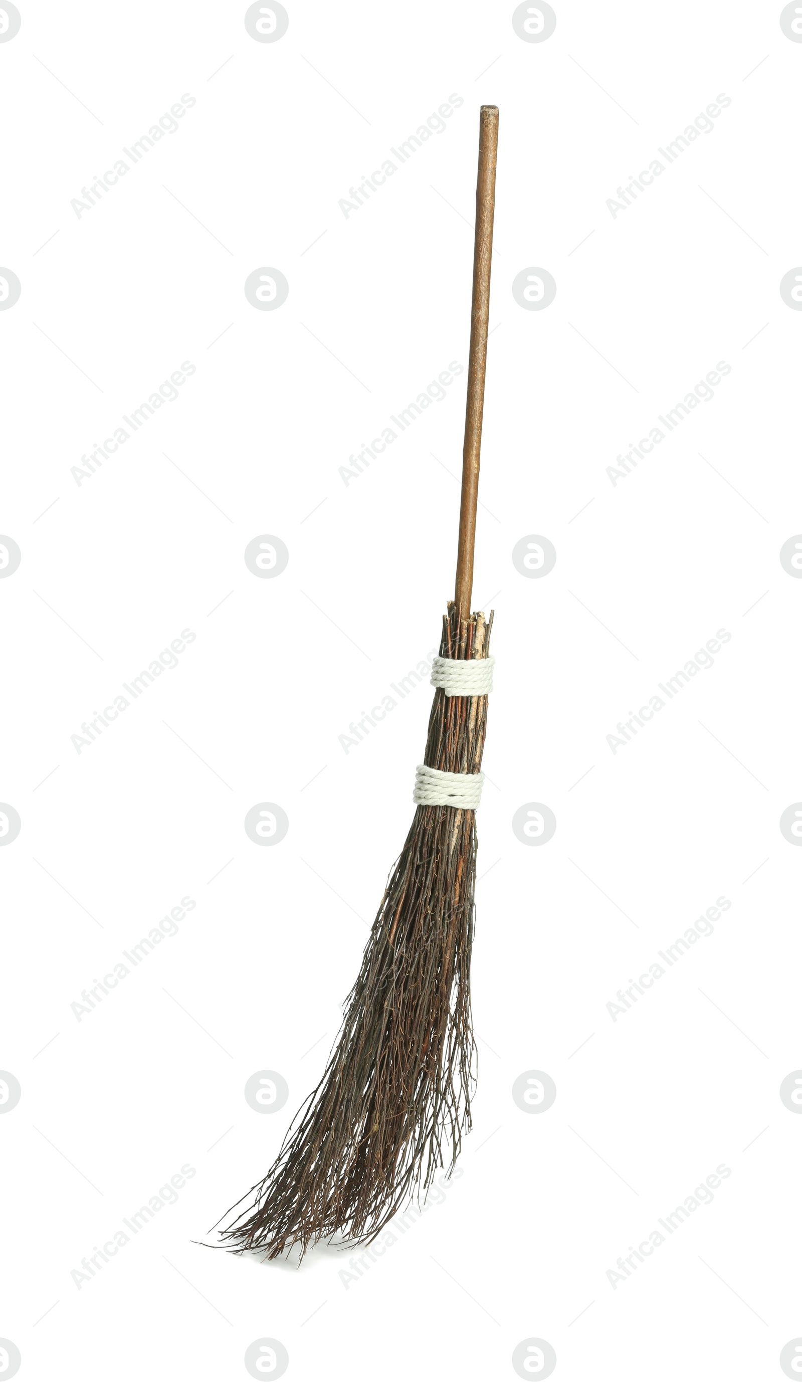 Photo of Old broom with wooden handle isolated on white