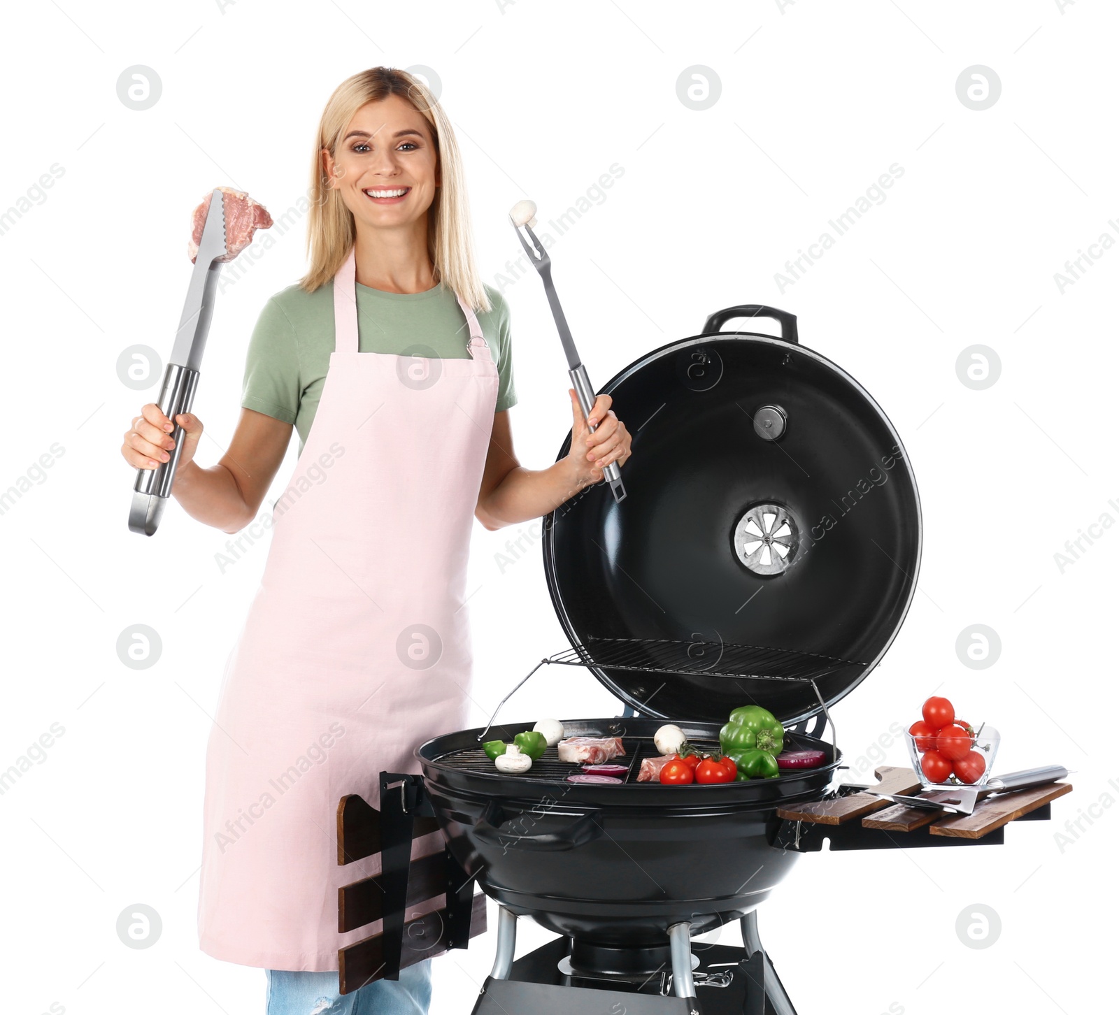 Photo of Woman in apron cooking on barbecue grill, white background