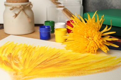 Photo of Canvas painting of chrysanthemum, flower and colorful paints, closeup