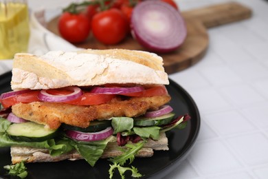 Photo of Delicious sandwich with schnitzel on white tiled table, closeup. Space for text