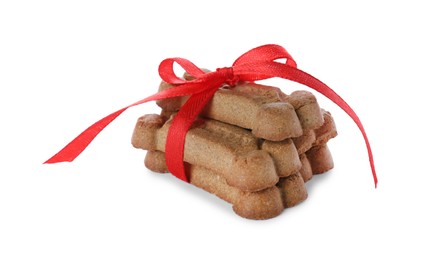 Photo of Bone shaped dog cookies with red bow isolated on white