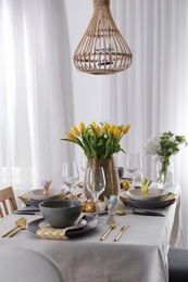 Beautiful Easter table setting with festive decor indoors