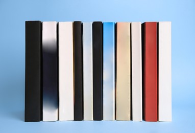 Collection of books on light blue background