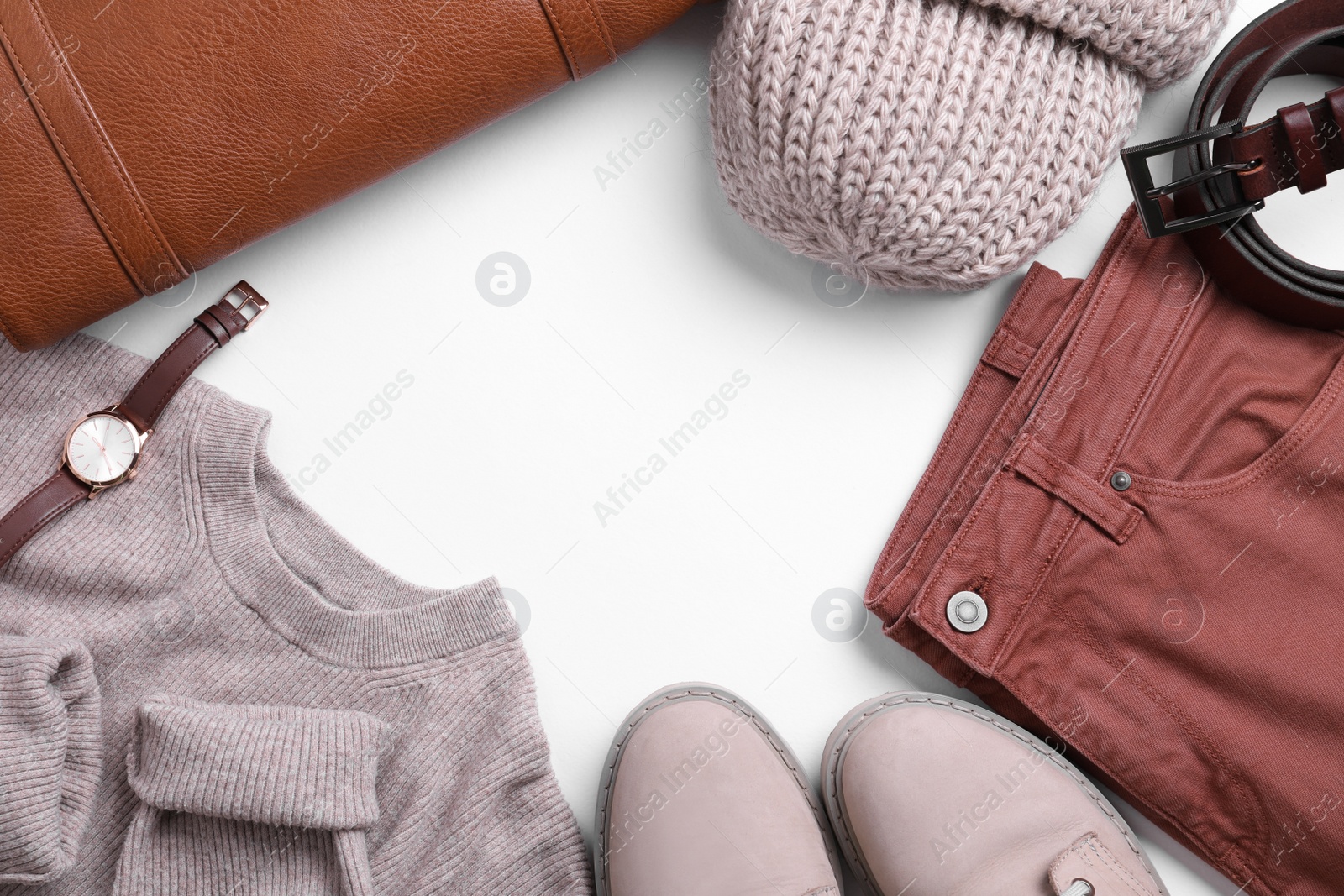 Photo of Fall and winter fashion. Layout with woman's outfit on white background, top view. Space for text