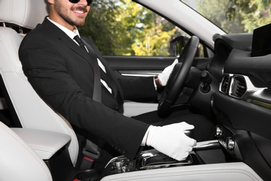 Driver in luxury car, closeup. Chauffeur service