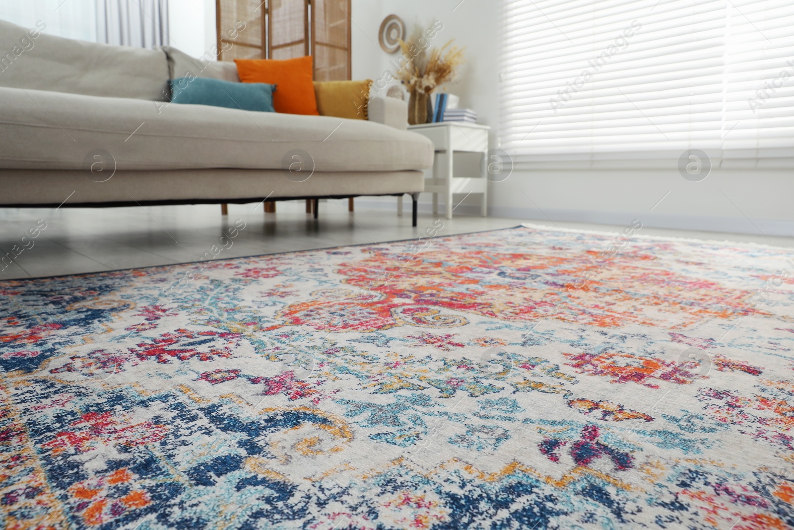 Photo of Stylish living room with beautiful carpet and furniture, closeup. Interior design