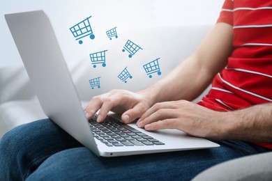 Image of Man using laptop for online shopping at home, closeup