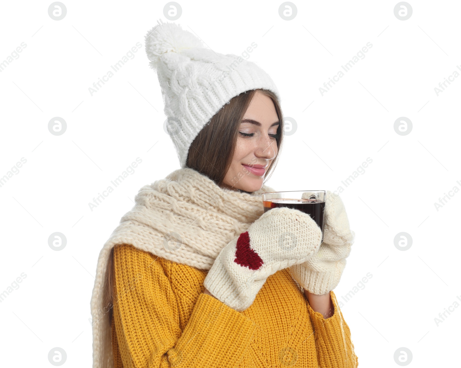 Photo of Happy beautiful woman with cup of mulled wine on white background