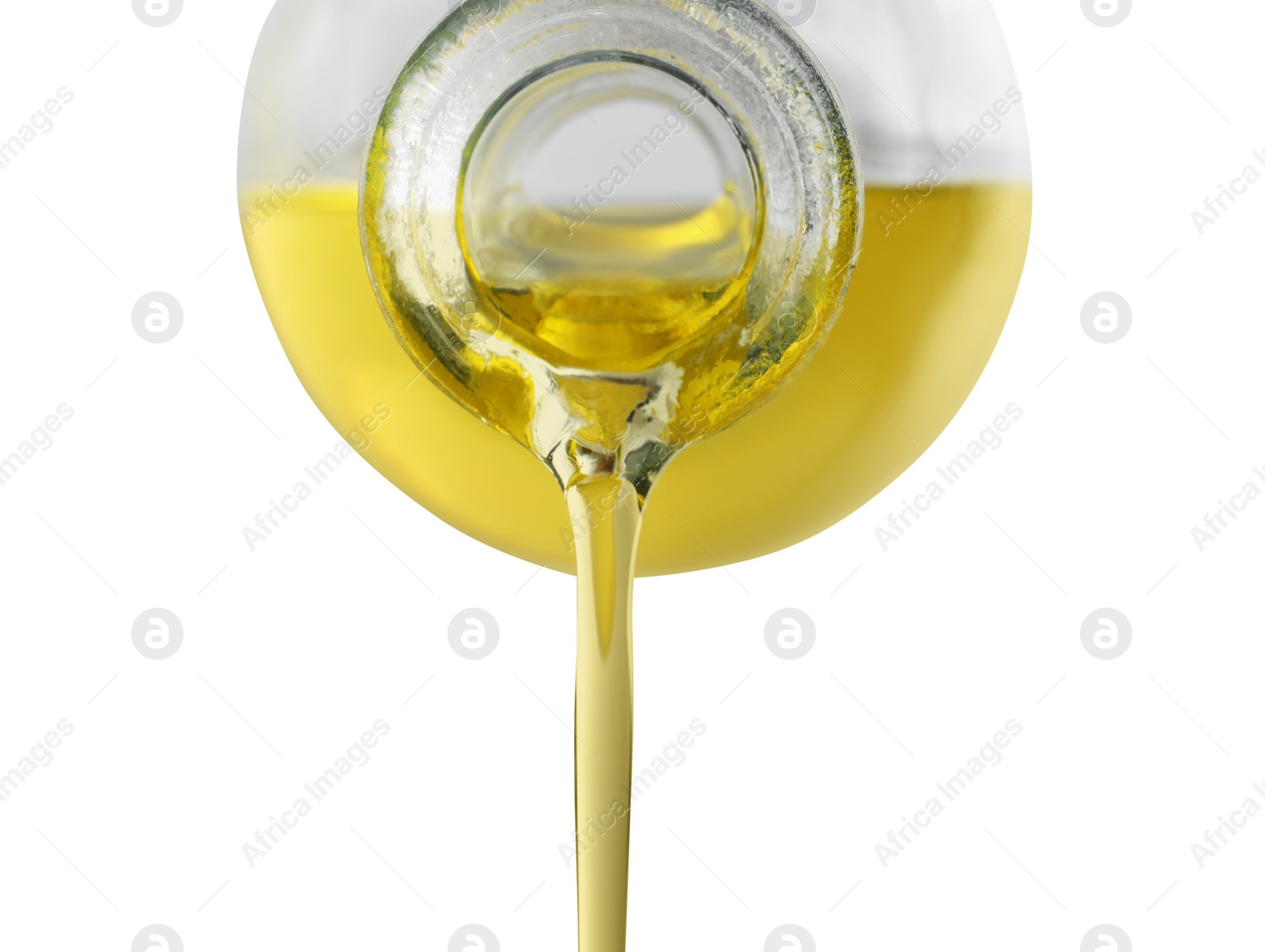 Photo of Pouring cooking oil from jug on white background, closeup