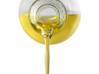Photo of Pouring cooking oil from jug on white background, closeup