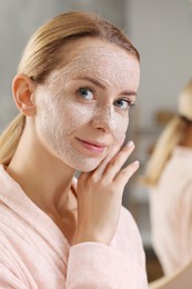 Photo of Woman with face mask indoors. Spa treatments