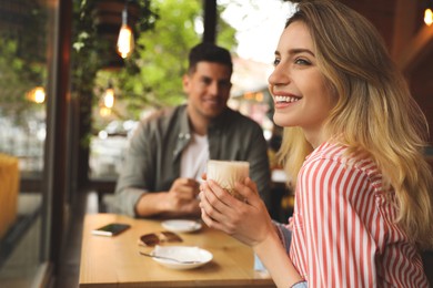 Lovely couple spending time at cafe in morning