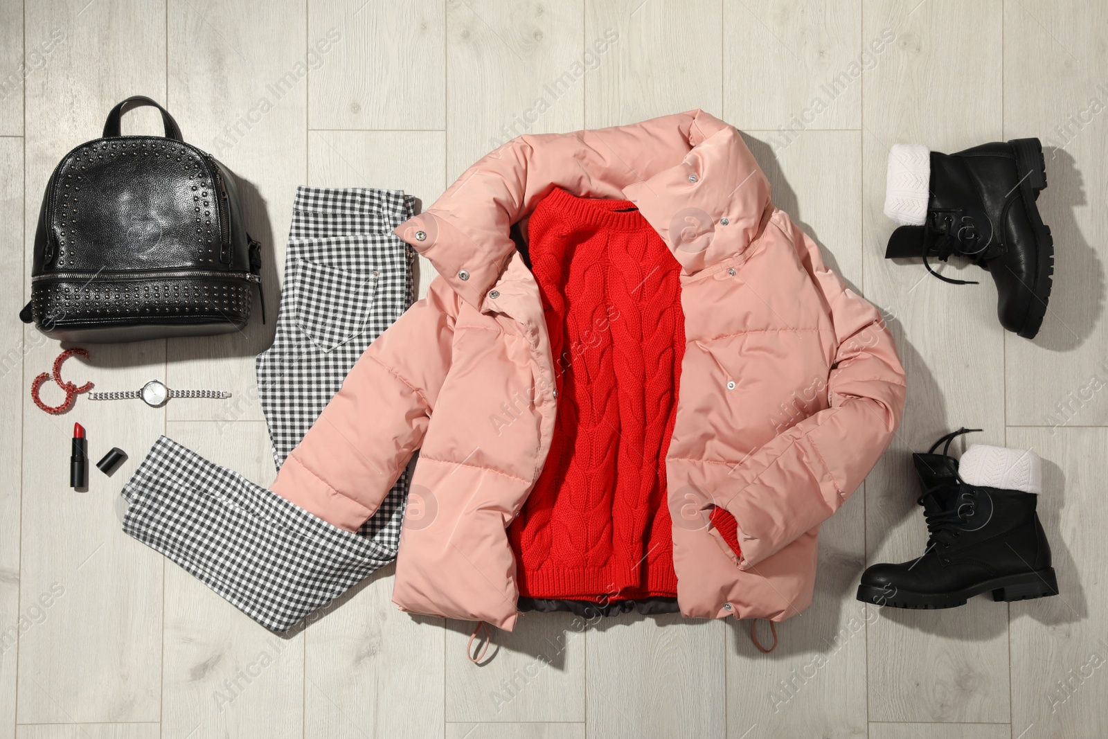 Photo of Set of stylish winter outfit on wooden background, flat lay