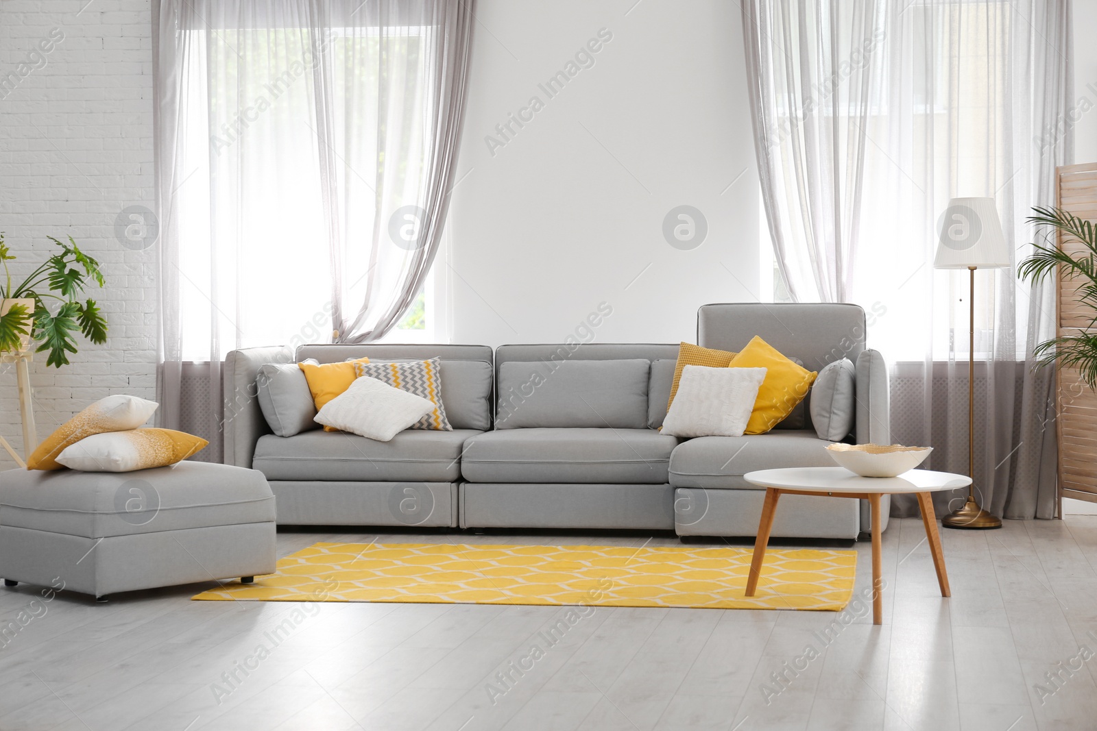 Photo of Living room with comfortable sofa and stylish decor. Idea for interior design