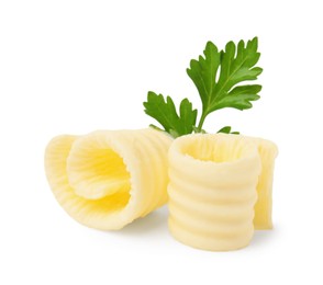 Photo of Tasty butter curls and fresh parsley isolated on white