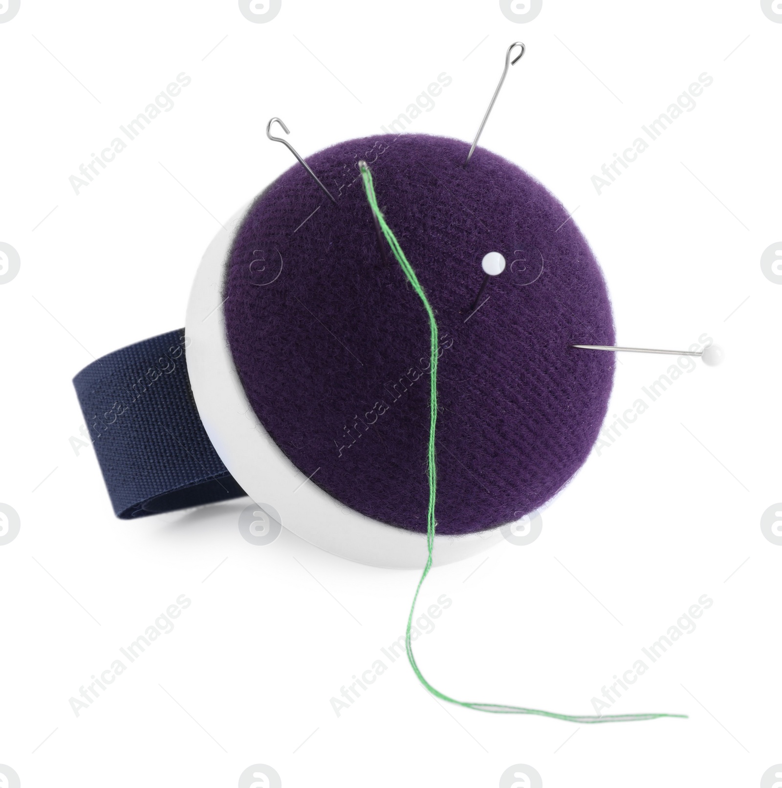 Photo of Pincushion, sewing needles, pins and thread isolated on white