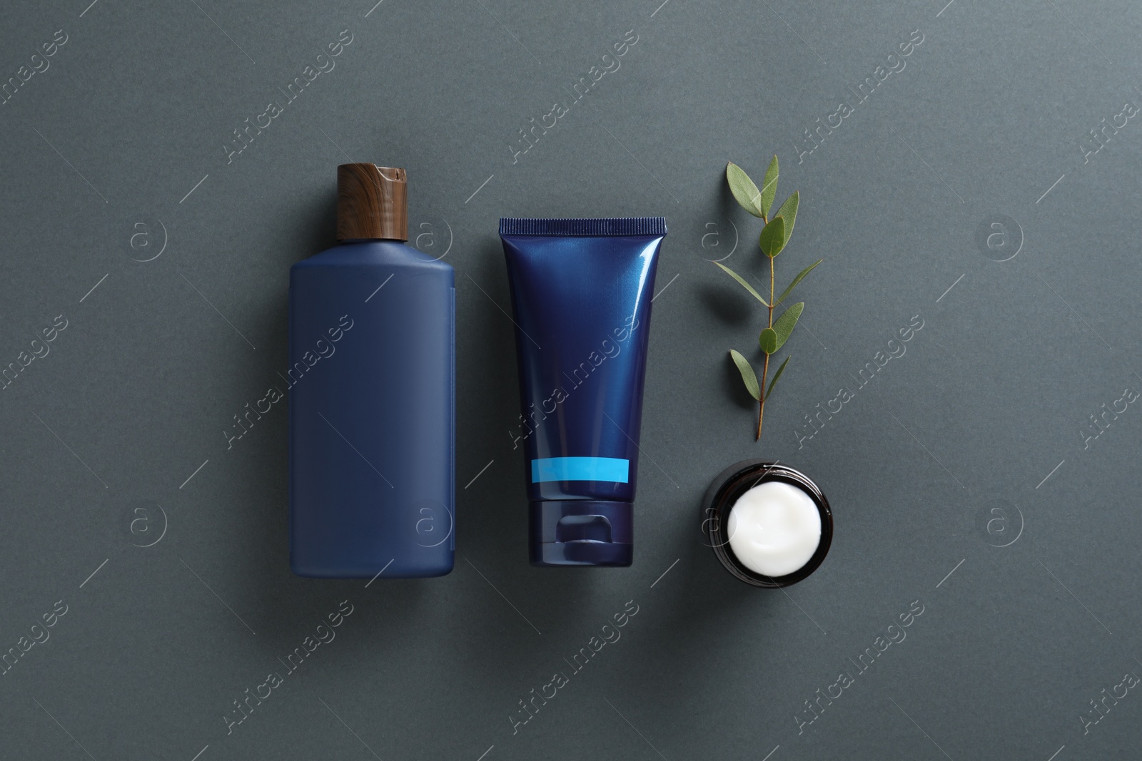 Photo of Facial cream and other men's cosmetic products on grey background, flat lay