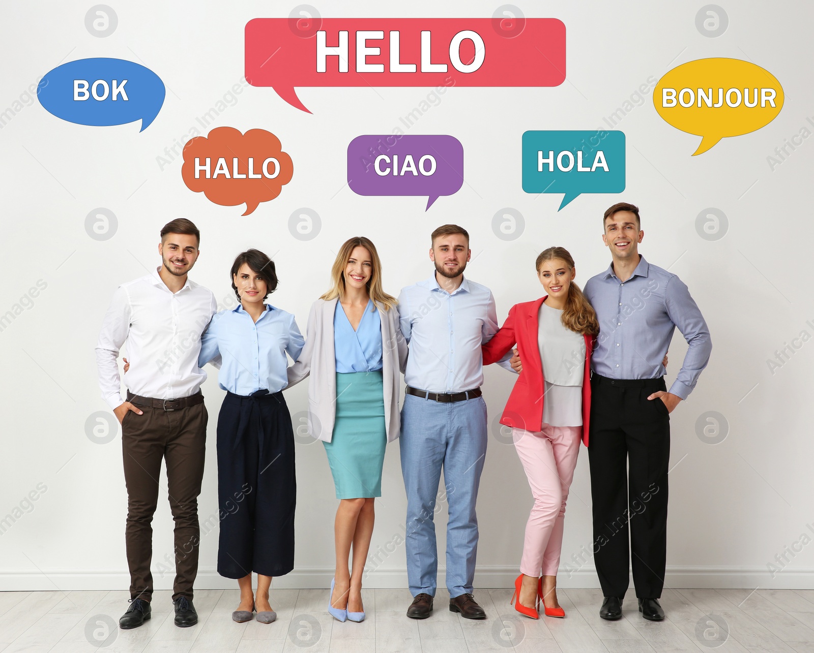 Image of Happy people posing near light wall and illustration of speech bubbles with word Hello written in different languages