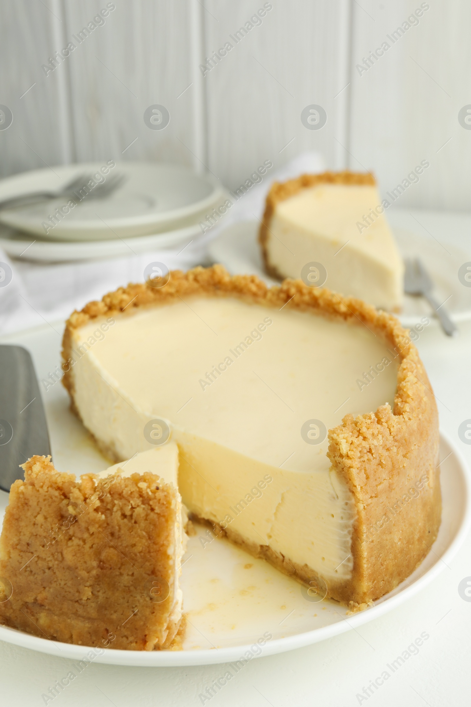 Photo of Tasty vegan tofu cheesecake on white table