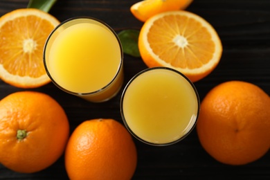 Photo of Flat lay composition with orange juice and fresh fruit on wooden background