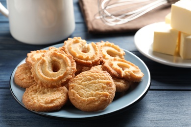 Photo of Plate with Danish butter cookies on table