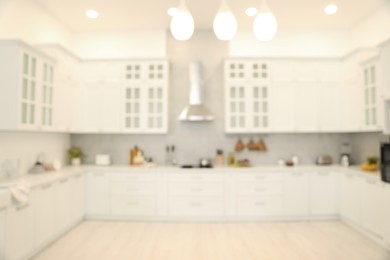 Photo of Blurred view of modern kitchen. Interior design