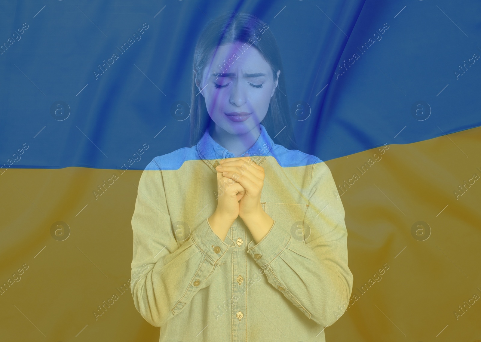 Image of Double exposure of national flag and woman praying. Stop war in Ukraine