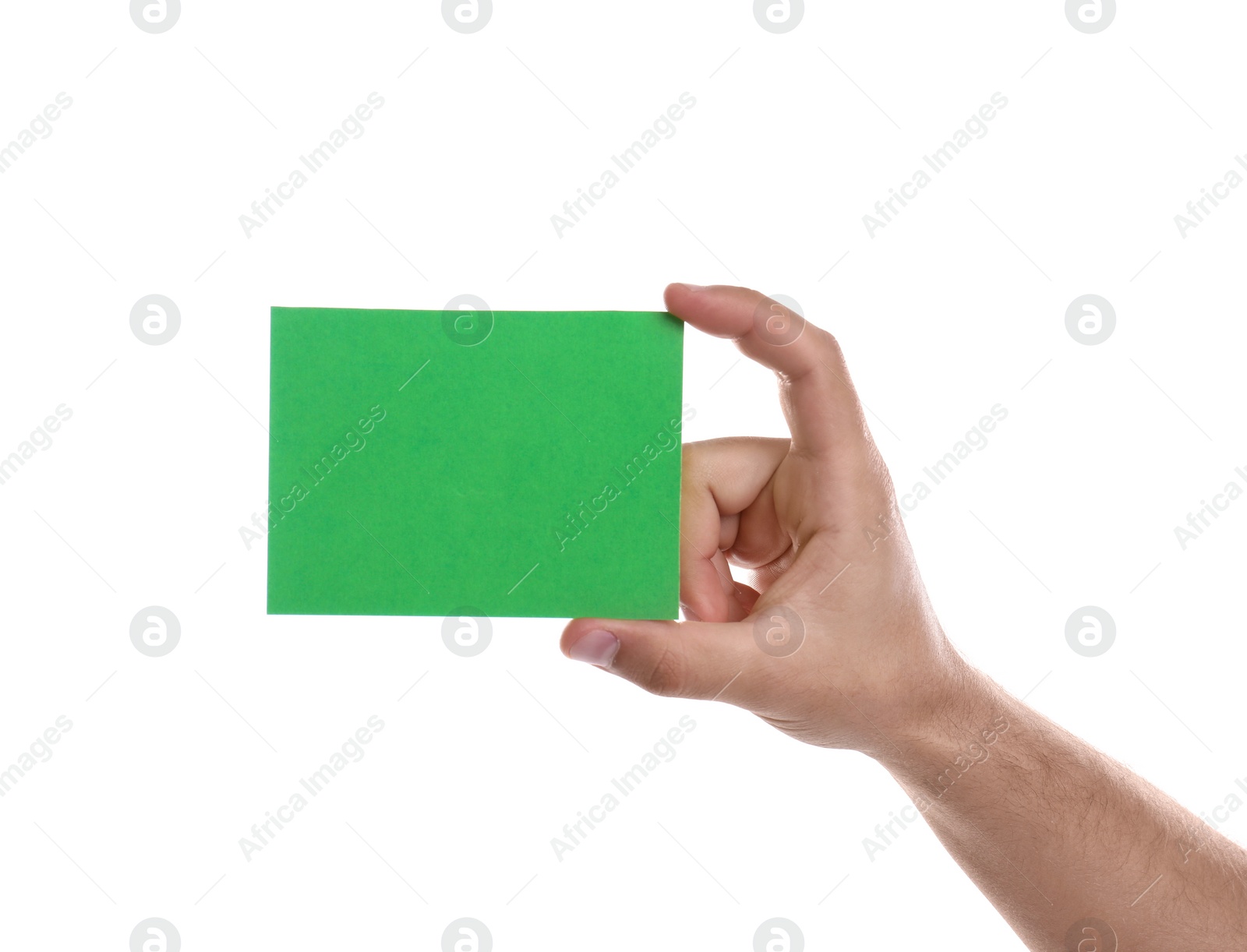 Photo of Football referee holding green card on white background, closeup