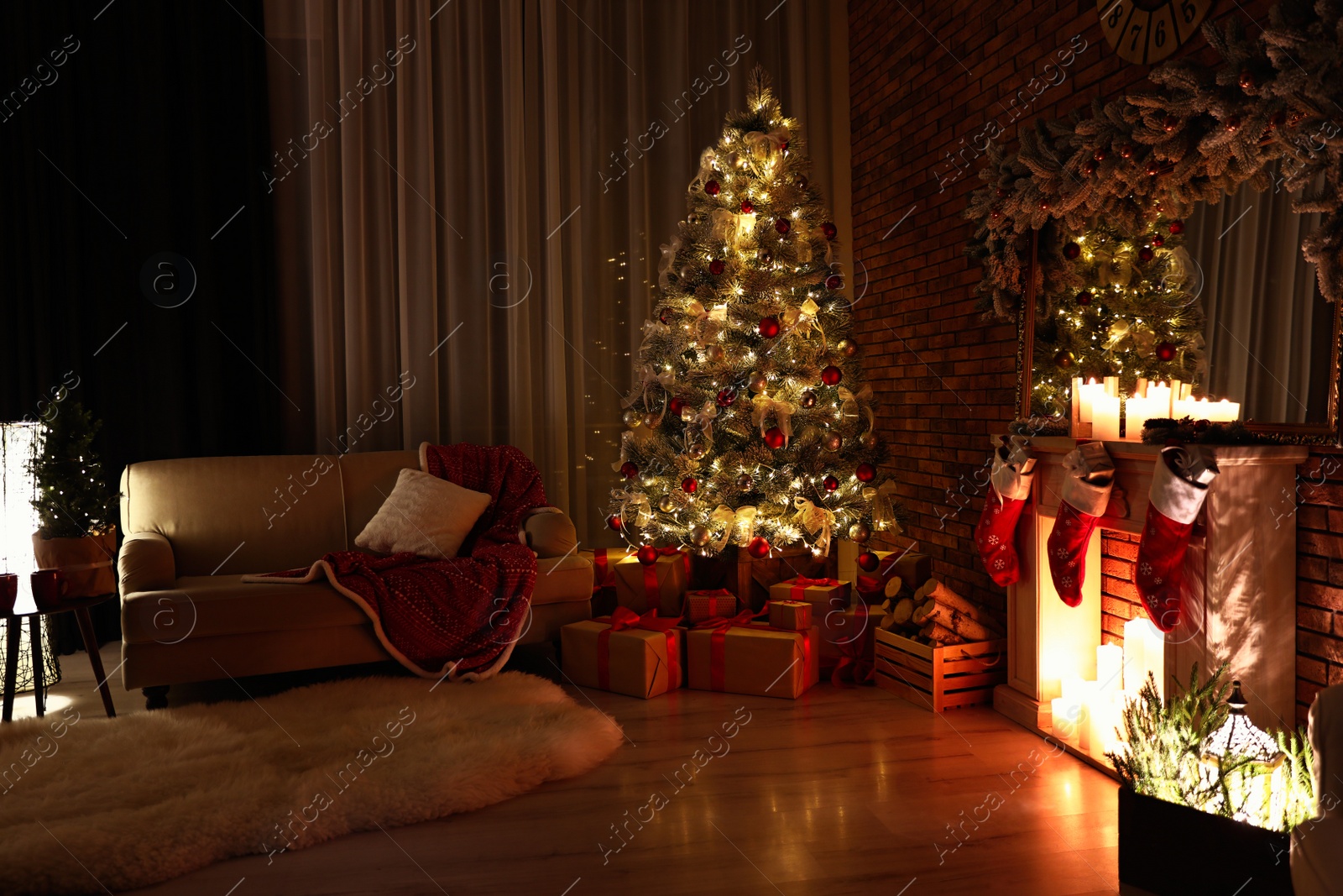 Photo of Stylish room interior with beautiful Christmas tree in evening