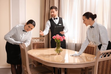 Photo of Group of people attending professional butler courses in hotel