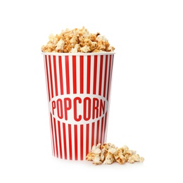 Photo of Carton cup with delicious fresh popcorn on white background