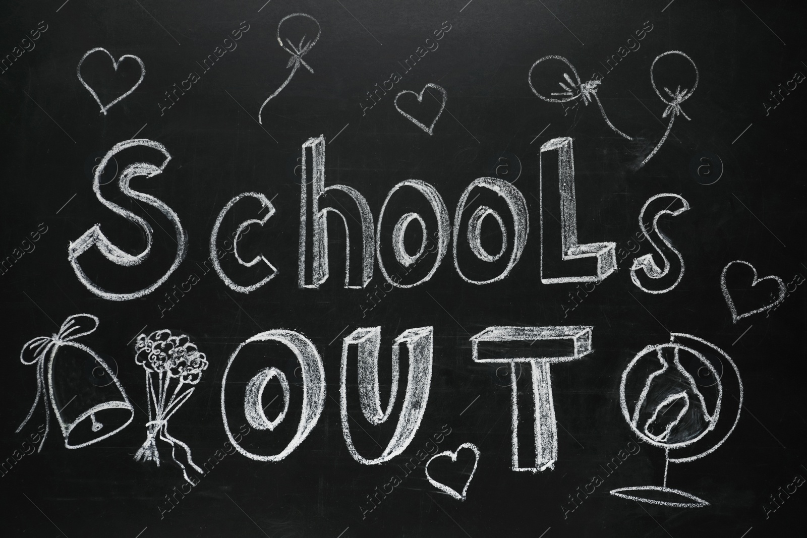 Photo of Text SCHOOL'S OUT and different drawings on blackboard. Summer holidays