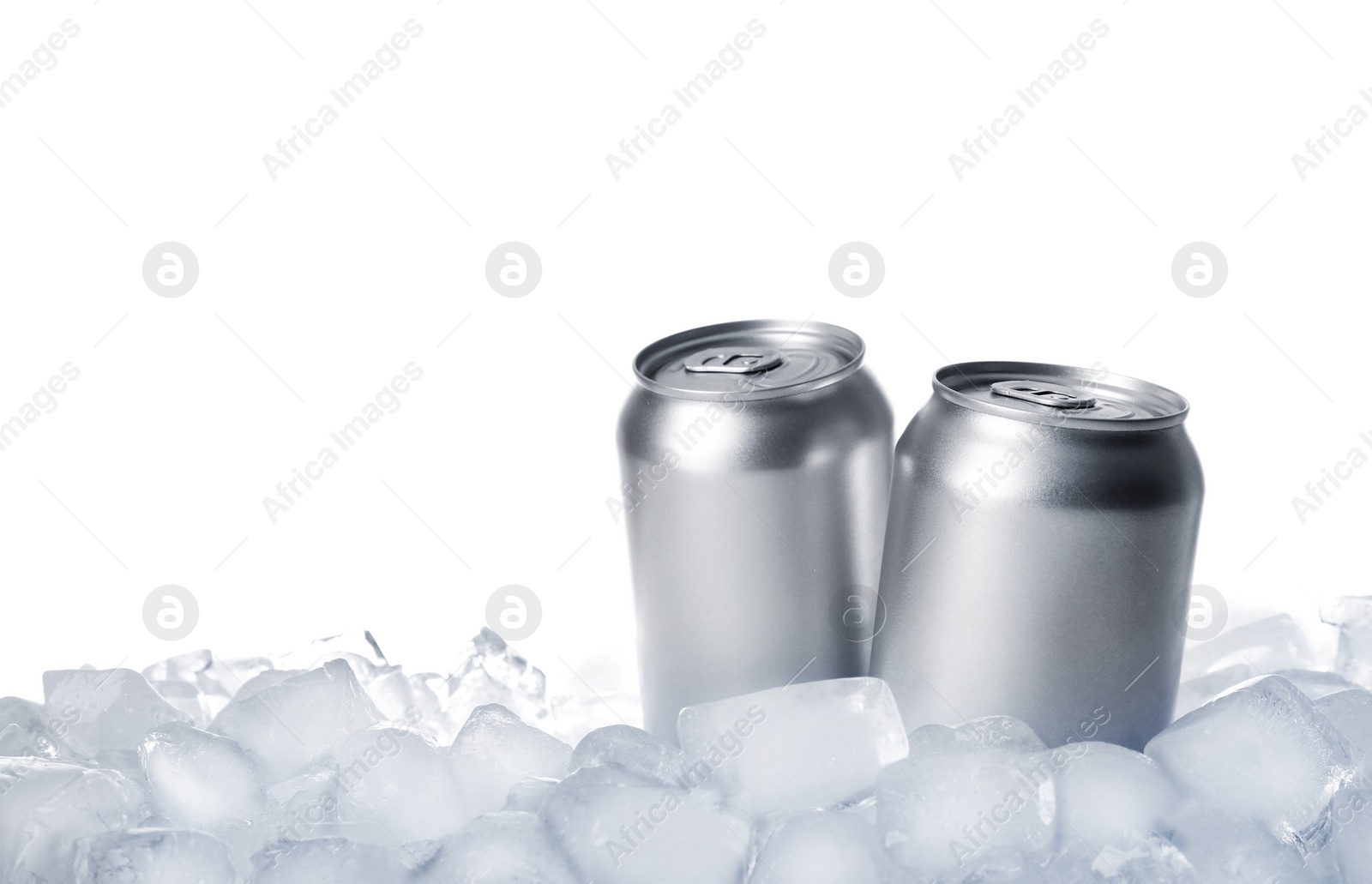 Photo of Tin cans on ice cubes against white background