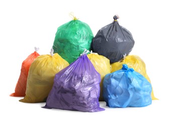 Trash bags full of garbage on white background