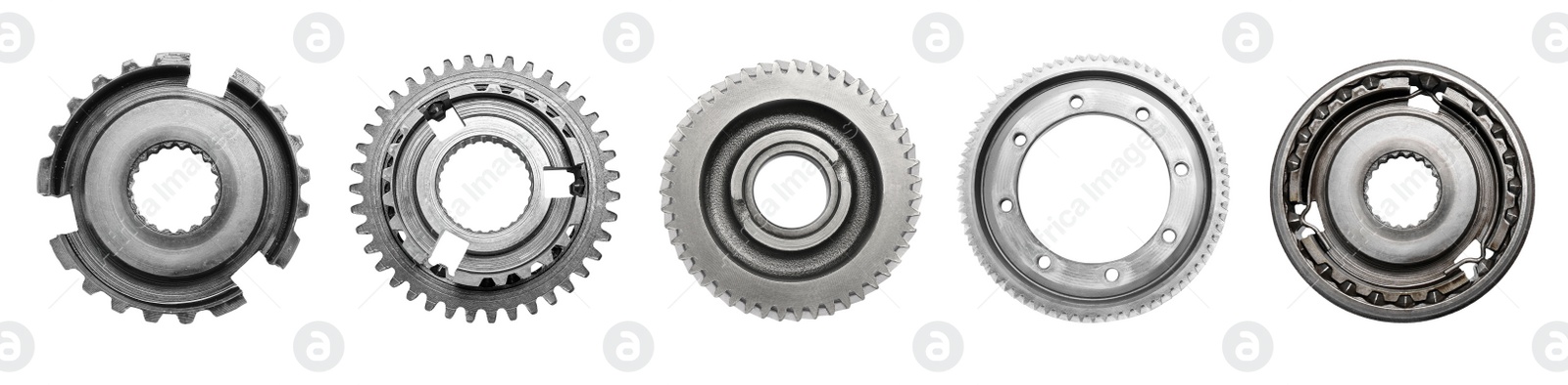 Image of Set with different stainless steel gears on white background, top view. Banner design