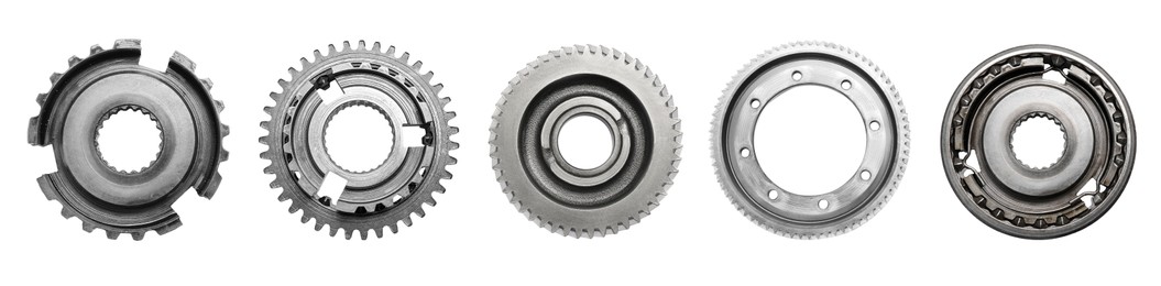 Image of Set with different stainless steel gears on white background, top view. Banner design