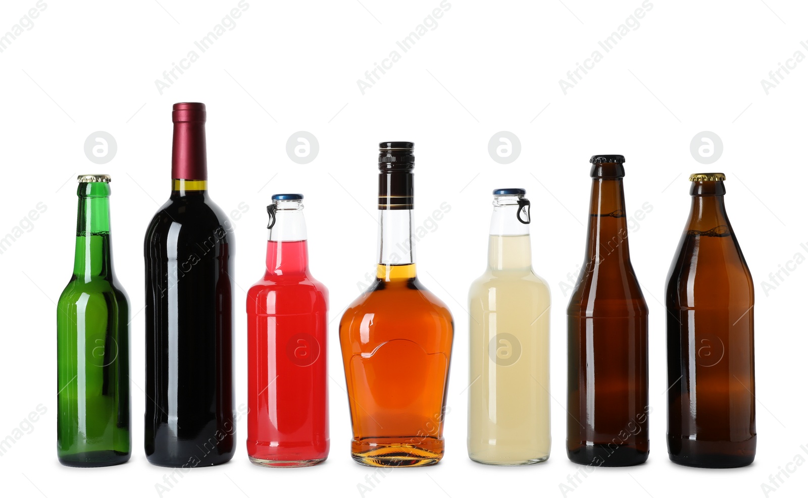 Photo of Bottles with different alcoholic drinks on white background