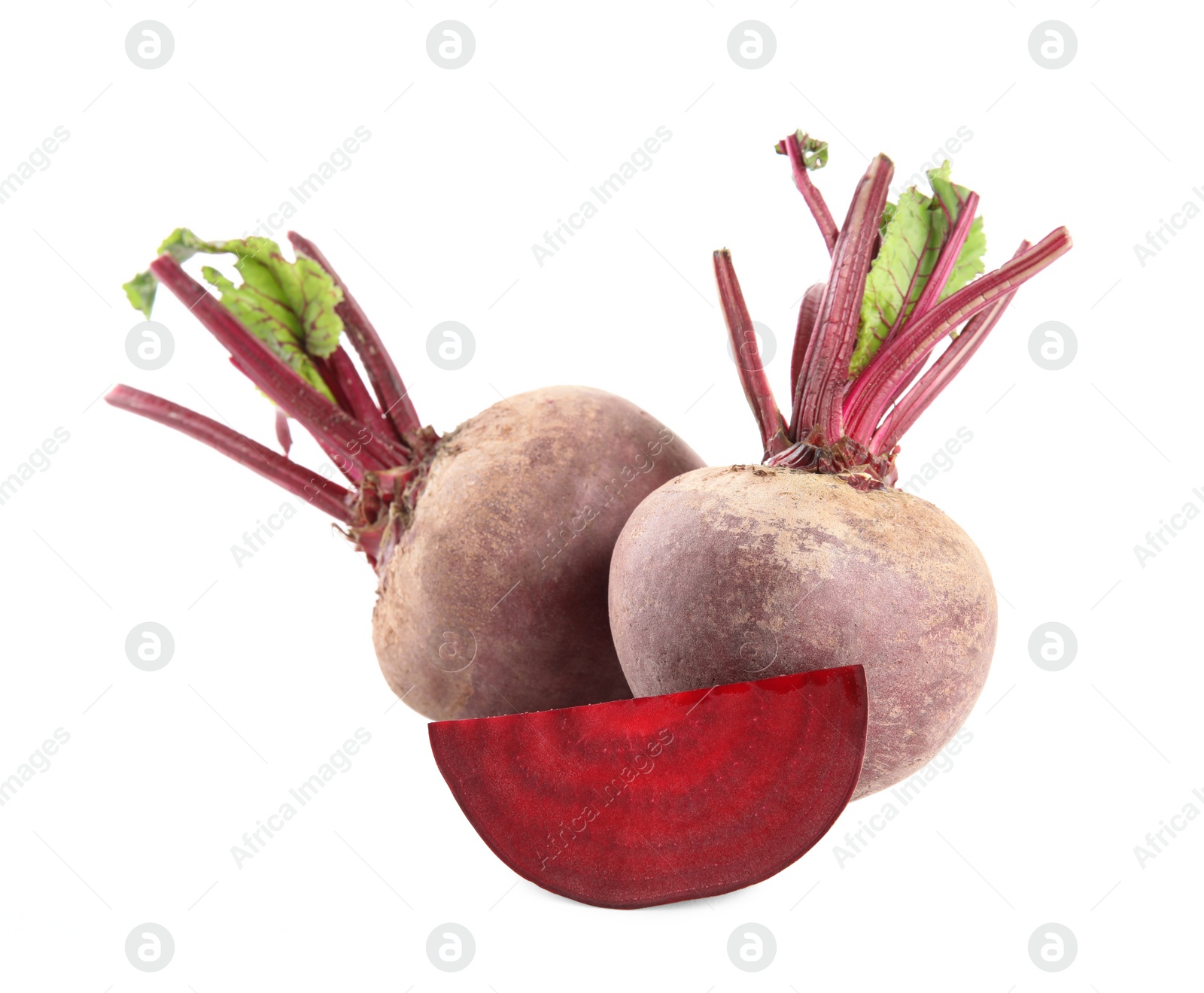 Photo of Whole and cut ripe beetroots on white background