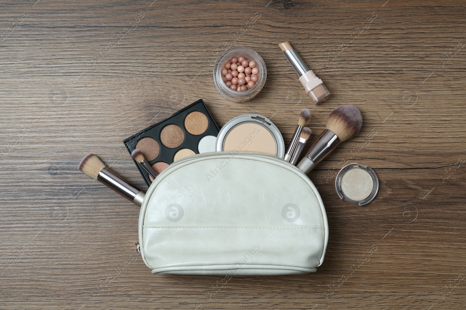 Photo of Flat lay composition with makeup products on wooden table