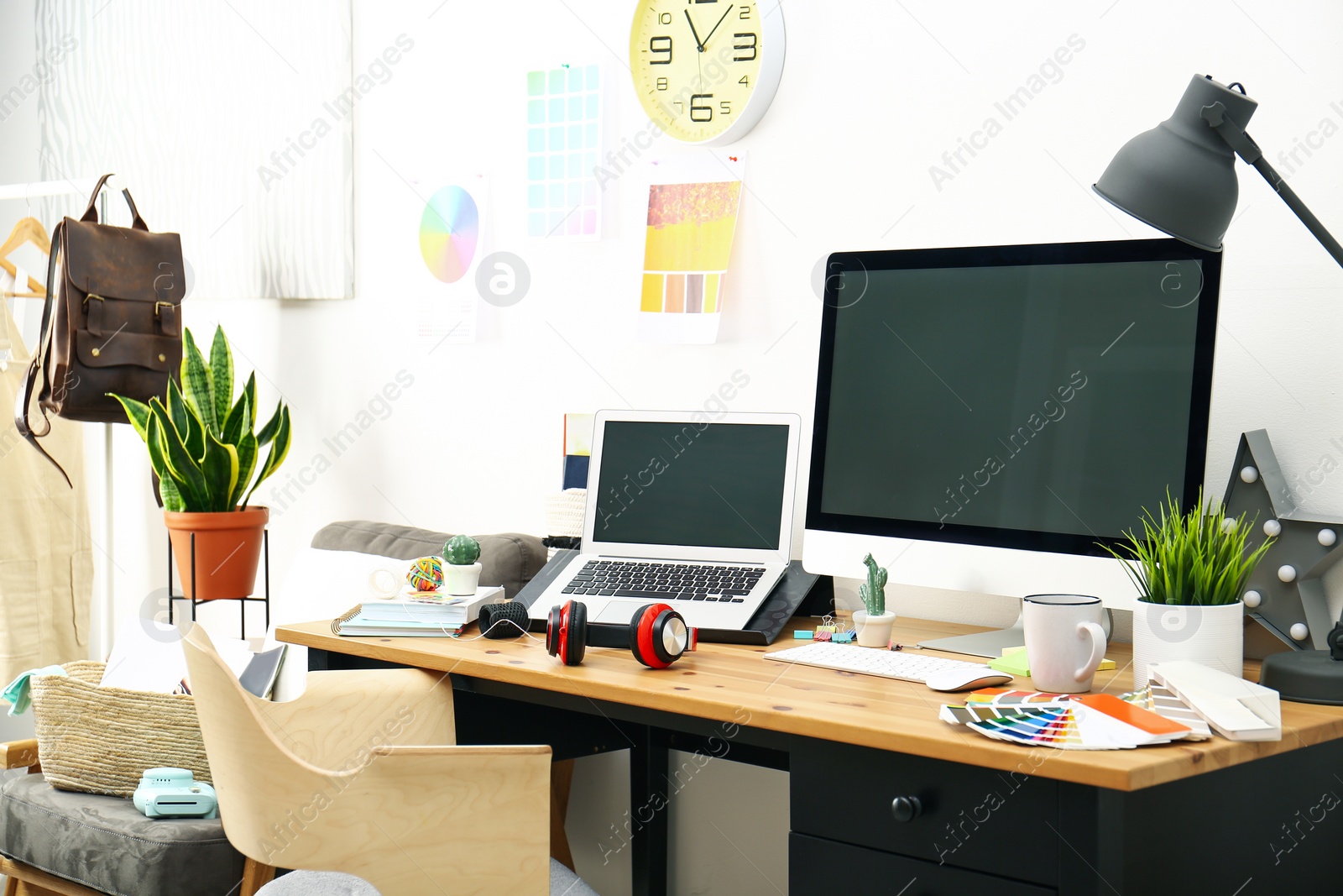 Photo of Modern laptop, computer and office supplies on wooden table, space for text. Designer's workplace