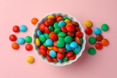 Photo of Tasty colorful candies on pink background, flat lay