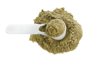 Photo of Hemp protein powder and measuring scoop on white background