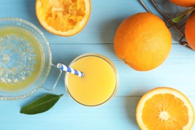 Flat lay composition with orange juice and fresh fruit on wooden background