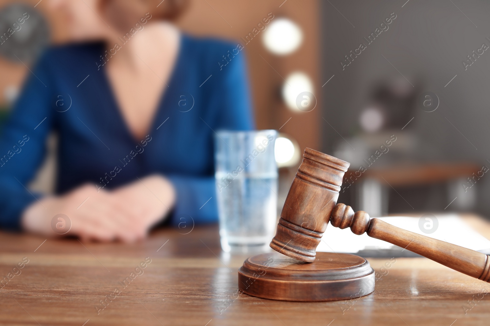 Photo of Gavel on table and lawyer in office