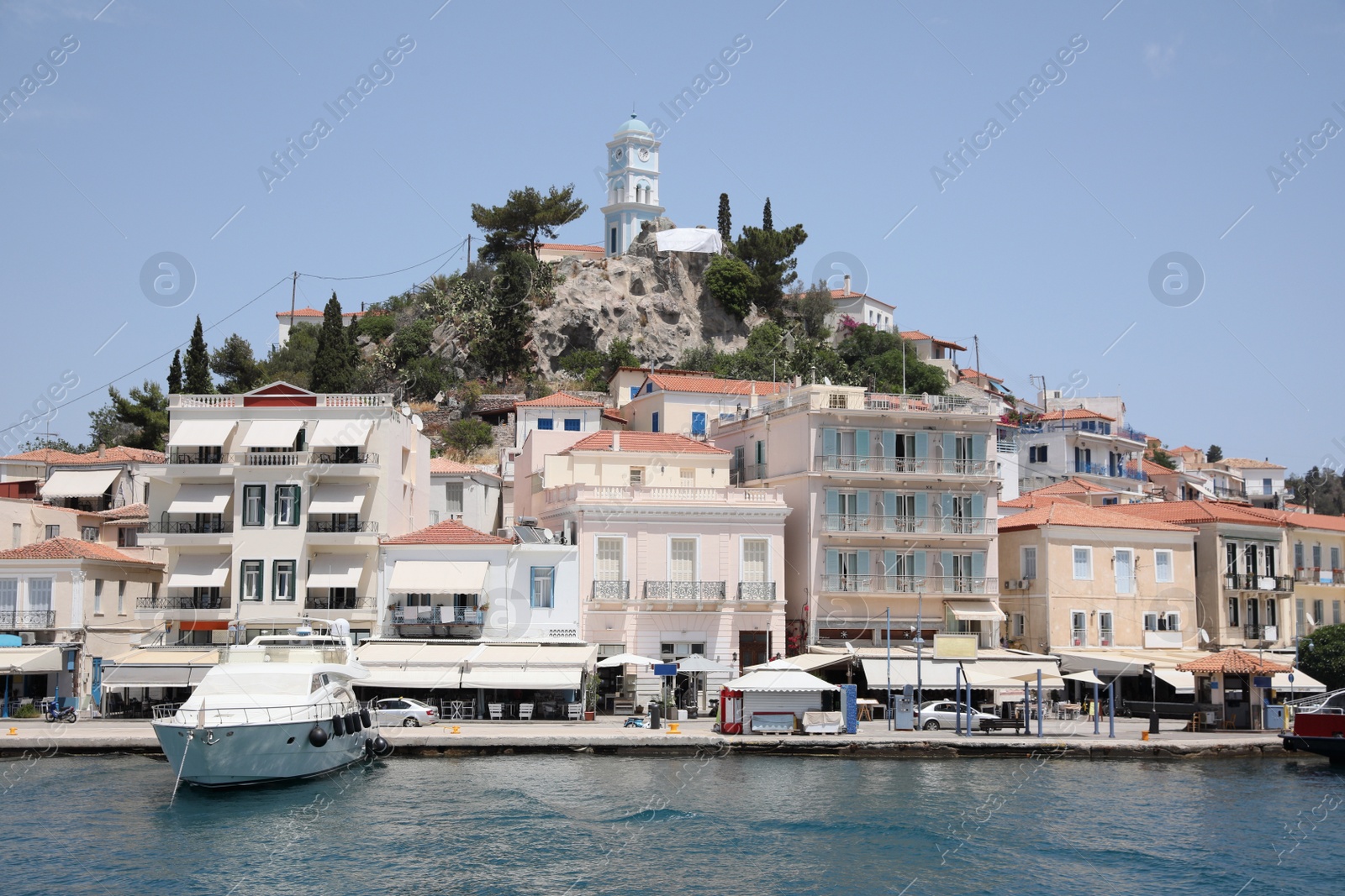 Photo of Beautiful view of coastal city and yacht on sunny day